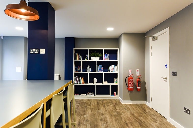 Navy and ochre landing decorated by Paint and Maintain